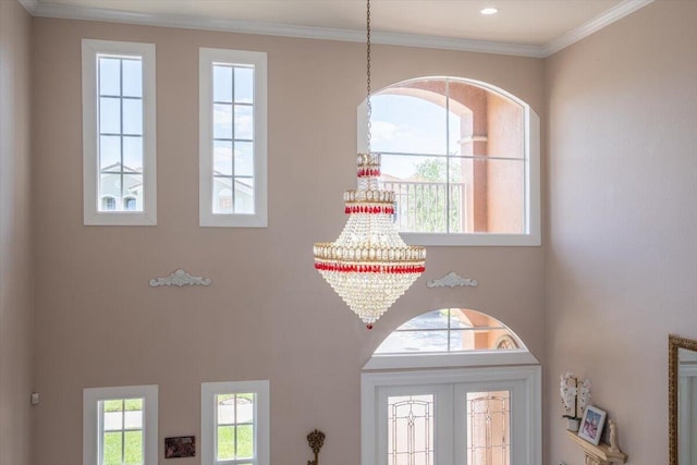 1018 NW Demedici Rd, Port Saint Lucie, FL 34986 - detailed view of a chandelier and ornamental molding