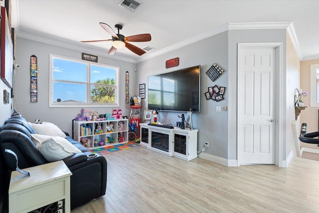 1018 NW Demedici Rd, Port Saint Lucie, FL 34986 - living room featuring ceiling fan, crown molding, wood finished floors, and baseboards