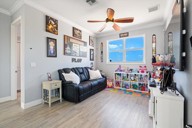 1018 NW Demedici Rd, Port Saint Lucie, FL 34986 - recreation room with light wood-type flooring, a ceiling fan, crown molding, and baseboards