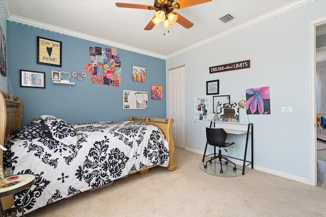 1018 NW Demedici Rd, Port Saint Lucie, FL 34986 - bedroom with carpet, ornamental molding, baseboards, a closet, and a ceiling fan