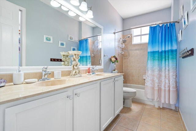 1018 NW Demedici Rd, Port Saint Lucie, FL 34986 - bathroom with tile patterned floors, double vanity, shower / bath combo with shower curtain, toilet, and baseboards