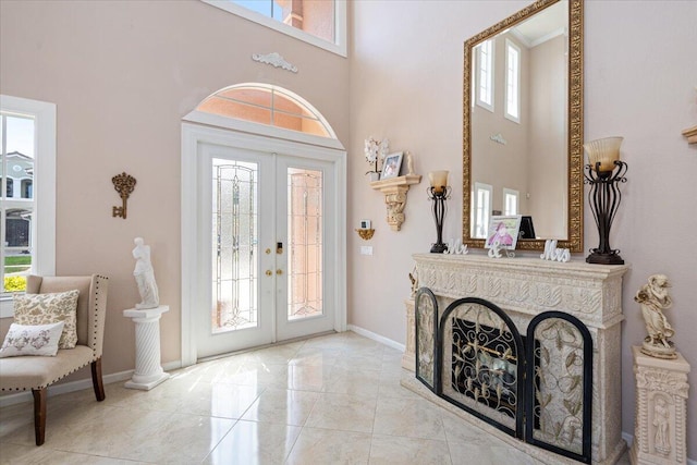 1018 NW Demedici Rd, Port Saint Lucie, FL 34986 - foyer featuring a high ceiling, french doors, and baseboards