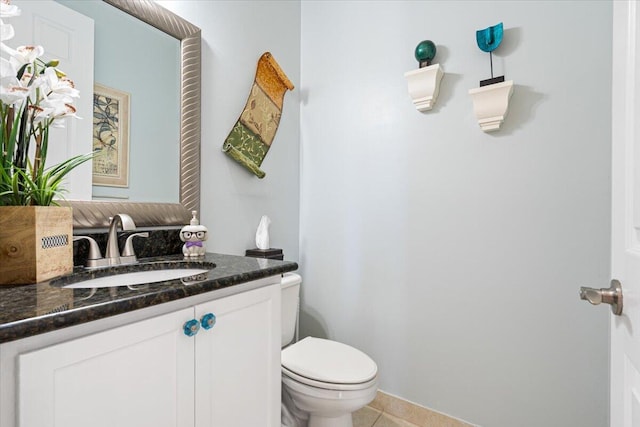 1018 NW Demedici Rd, Port Saint Lucie, FL 34986 - bathroom featuring toilet, vanity, and tile patterned floors