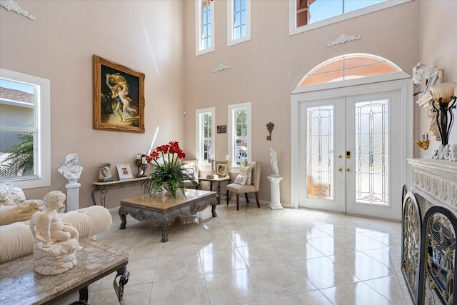 1018 NW Demedici Rd, Port Saint Lucie, FL 34986 - entryway with a high ceiling, french doors, and baseboards