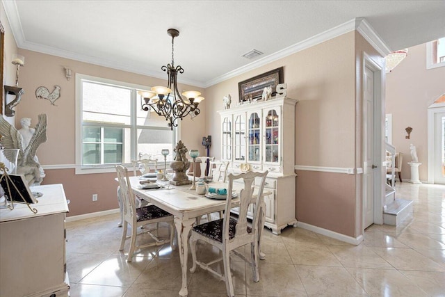 1018 NW Demedici Rd, Port Saint Lucie, FL 34986 - dining space with ornamental molding, a chandelier, and light tile patterned flooring