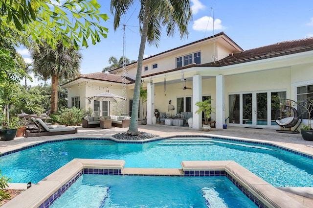 2409 NE 12th St, Fort Lauderdale, FL 33304 - rear view of property featuring an outdoor living space, a patio, french doors, and stucco siding