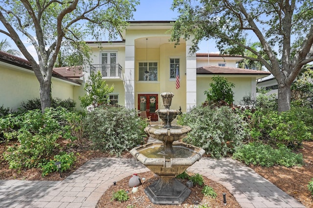 2409 NE 12th St, Fort Lauderdale, FL 33304 - mediterranean / spanish-style house featuring french doors, a balcony, and stucco siding