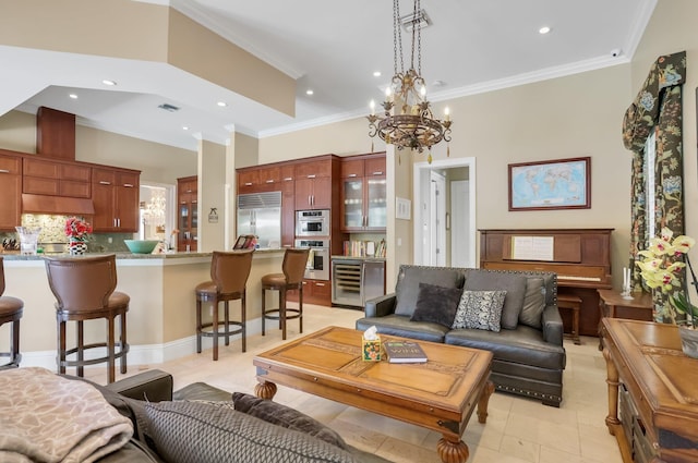 2409 NE 12th St, Fort Lauderdale, FL 33304 - living area with a notable chandelier, ornamental molding, beverage cooler, and recessed lighting