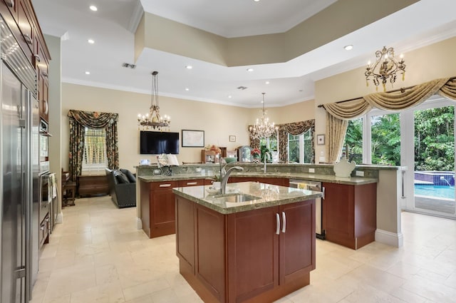 2409 NE 12th St, Fort Lauderdale, FL 33304 - kitchen featuring recessed lighting, stainless steel appliances, a sink, a spacious island, and a chandelier