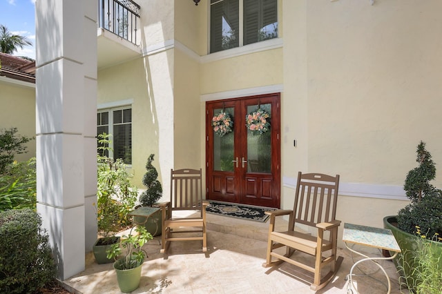 2409 NE 12th St, Fort Lauderdale, FL 33304 - view of exterior entry with french doors and stucco siding