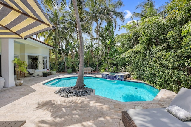 2409 NE 12th St, Fort Lauderdale, FL 33304 - view of pool featuring a patio area and a pool with connected hot tub