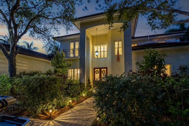 2409 NE 12th St, Fort Lauderdale, FL 33304 - property entrance featuring stucco siding, a balcony, and french doors