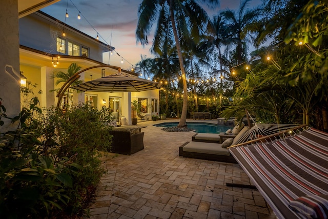2409 NE 12th St, Fort Lauderdale, FL 33304 - patio terrace at dusk with an outdoor pool