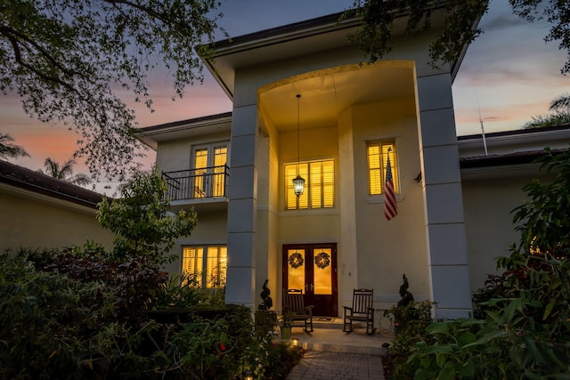 2409 NE 12th St, Fort Lauderdale, FL 33304 - exterior space with french doors, a balcony, and stucco siding