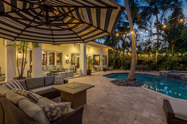 2409 NE 12th St, Fort Lauderdale, FL 33304 - view of pool with an outdoor living space, a patio area, a pool with connected hot tub, and ceiling fan