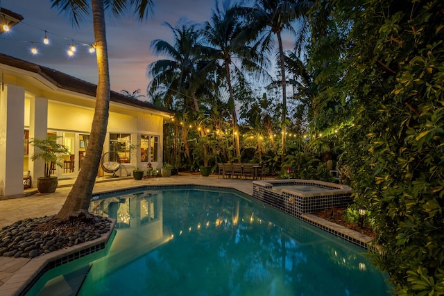2409 NE 12th St, Fort Lauderdale, FL 33304 - view of swimming pool featuring a patio area and a pool with connected hot tub