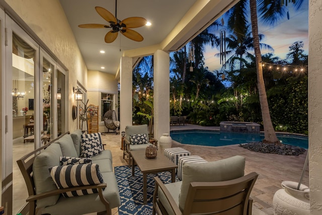 2409 NE 12th St, Fort Lauderdale, FL 33304 - patio terrace at dusk with an outdoor living space, ceiling fan, and a pool with connected hot tub