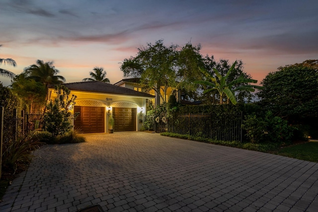2409 NE 12th St, Fort Lauderdale, FL 33304 - garage featuring fence and decorative driveway