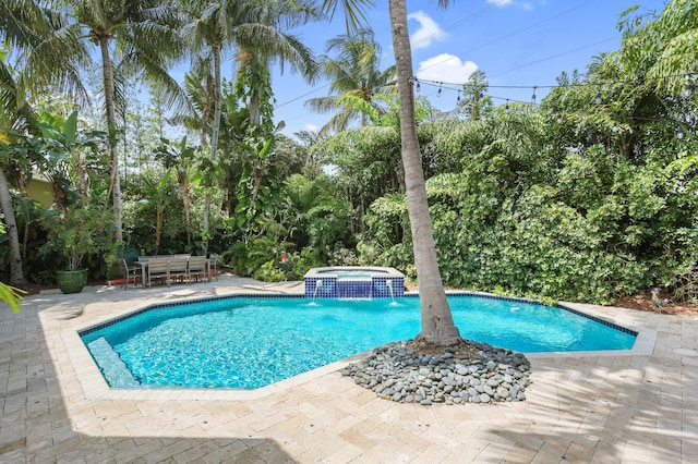 2409 NE 12th St, Fort Lauderdale, FL 33304 - view of pool featuring a patio and a pool with connected hot tub