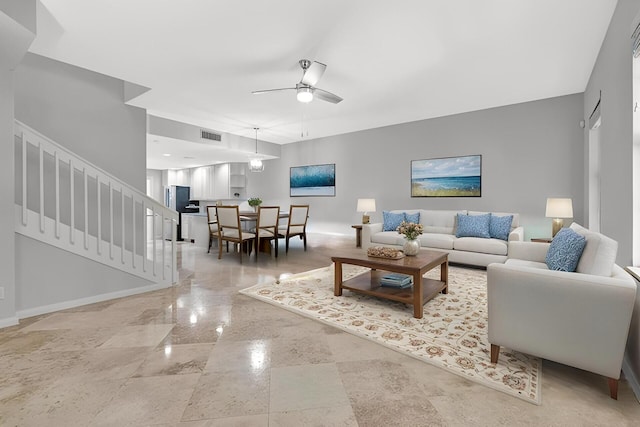 3216 W Community Dr, Jupiter, FL 33458 - living room with stairs, baseboards, and ceiling fan