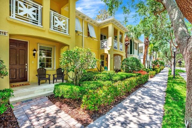 3216 W Community Dr, Jupiter, FL 33458 - entrance to property with stucco siding and covered porch