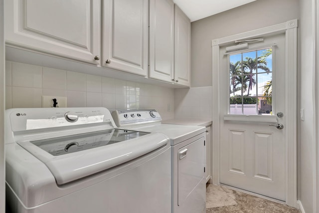3216 W Community Dr, Jupiter, FL 33458 - washroom featuring cabinet space and separate washer and dryer