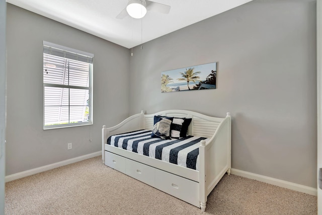 3216 W Community Dr, Jupiter, FL 33458 - bedroom featuring light colored carpet, baseboards, and a ceiling fan