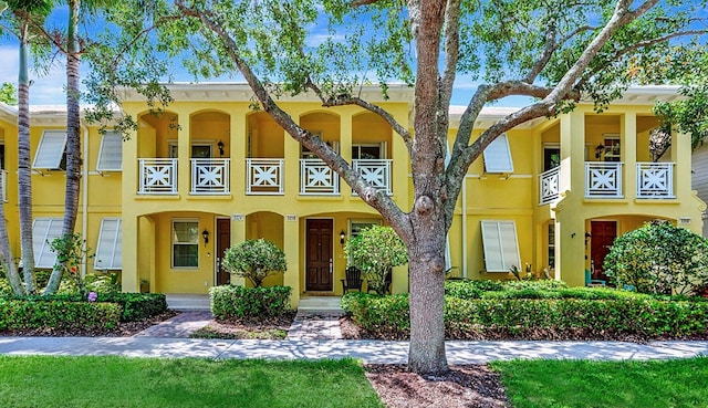 3216 W Community Dr, Jupiter, FL 33458 - townhome / multi-family property featuring a balcony and stucco siding