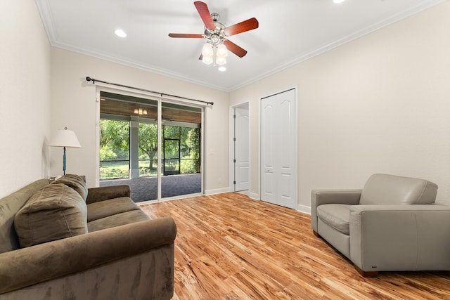 living area with recessed lighting, light wood-style floors, ceiling fan, and ornamental molding