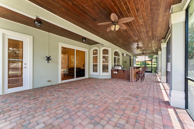 view of patio / terrace with outdoor dry bar and ceiling fan