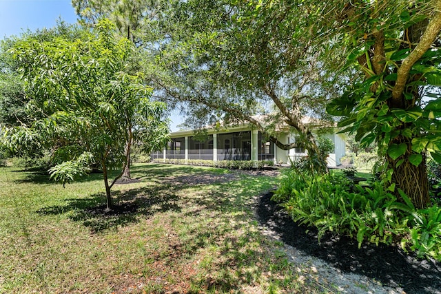view of yard featuring a sunroom