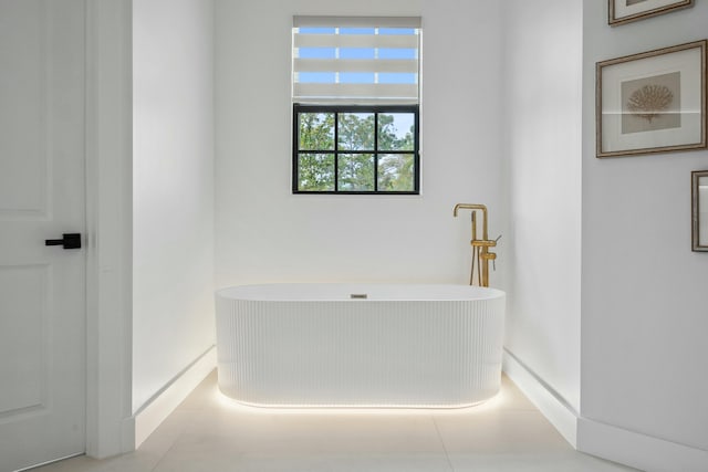 5214 SW Pomegranate Way, Palm City, FL 34990 - full bath featuring baseboards and a freestanding bath