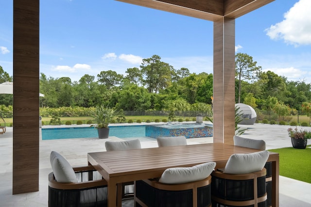 5214 SW Pomegranate Way, Palm City, FL 34990 - view of patio / terrace with outdoor dining area, an outdoor pool, and fence
