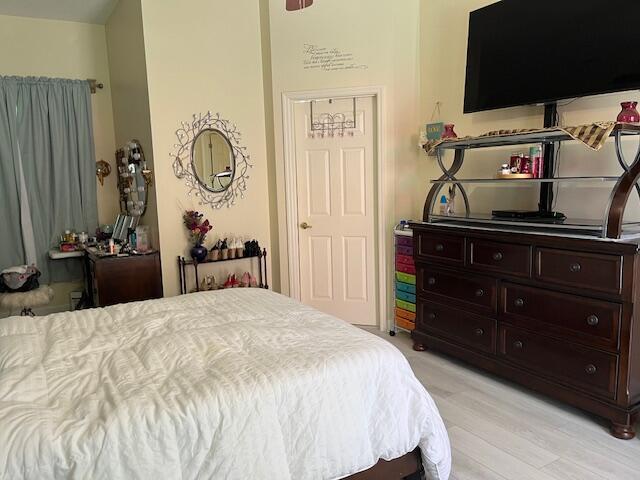 bedroom featuring light wood-style floors