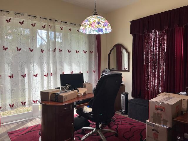 home office with wood finished floors