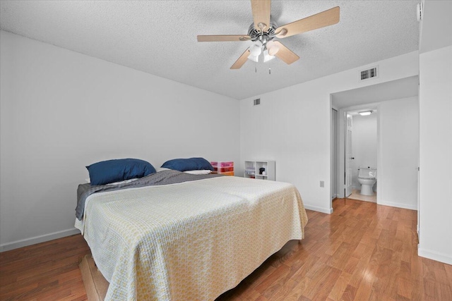 3526 Whitehall Dr Unit 106, West Palm Beach, FL 33401 - bedroom featuring wood finished floors, baseboards, a textured ceiling, and ceiling fan