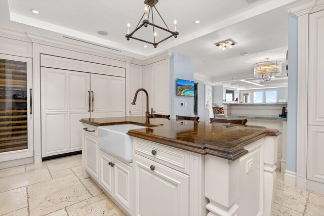 2500 S Ocean Blvd Unit Ph2, Boca Raton, FL 33432 - kitchen featuring a chandelier, a sink, stone tile flooring, paneled built in refrigerator, and an island with sink