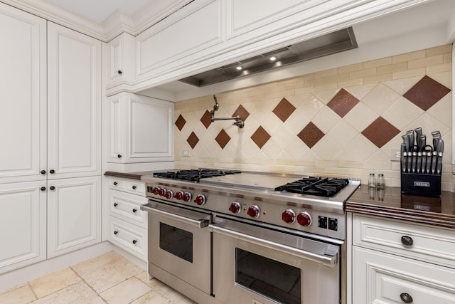 2500 S Ocean Blvd Unit Ph2, Boca Raton, FL 33432 - kitchen featuring range with two ovens, tasteful backsplash, white cabinetry, and custom range hood