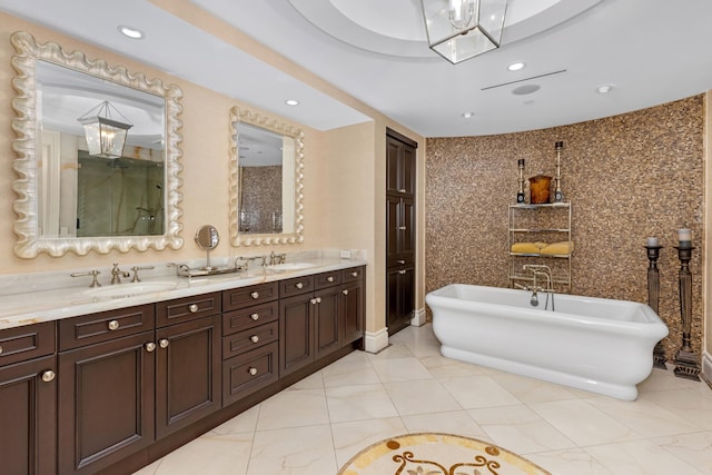 2500 S Ocean Blvd Unit Ph2, Boca Raton, FL 33432 - bathroom with a freestanding tub, double vanity, recessed lighting, and tile patterned flooring