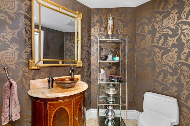 2500 S Ocean Blvd Unit Ph2, Boca Raton, FL 33432 - half bathroom featuring wallpapered walls, toilet, vanity, and baseboards