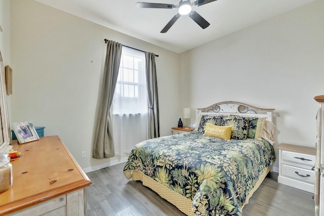 bedroom with light wood-type flooring and ceiling fan