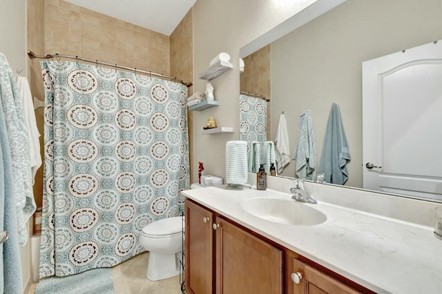 bathroom with tile patterned floors, vanity, and toilet