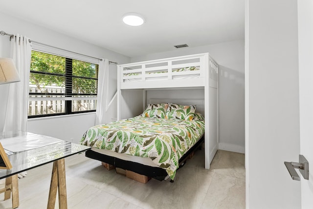 bedroom with visible vents and baseboards