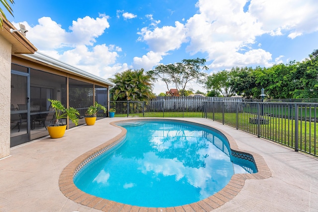 view of pool featuring a fenced in pool, a fenced backyard, a lawn, a sunroom, and a patio
