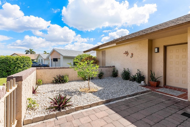exterior space featuring a residential view and fence