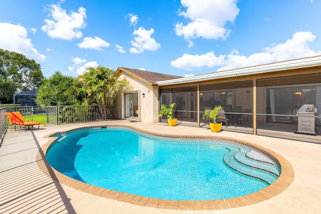 view of swimming pool featuring a patio area and a fenced in pool