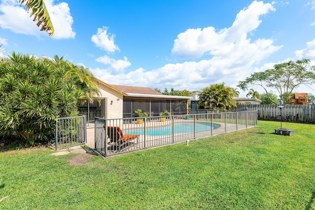 view of swimming pool featuring a fenced in pool, a fenced backyard, a patio, a lawn, and a sunroom