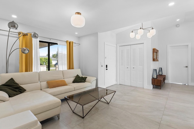 living area featuring vaulted ceiling and recessed lighting