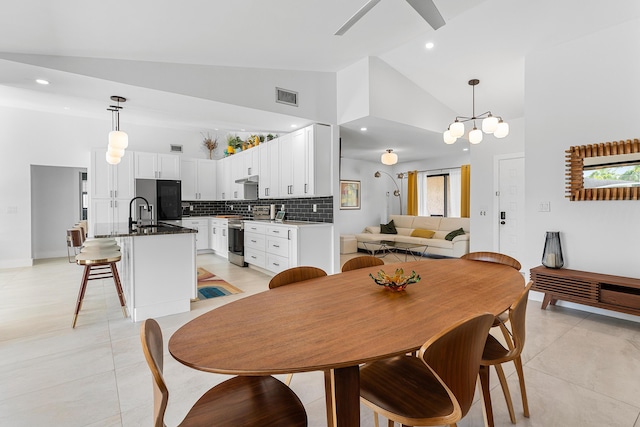 dining room with high vaulted ceiling, recessed lighting, visible vents, and plenty of natural light