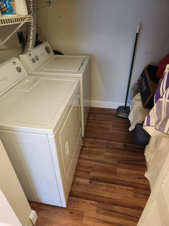 625 Pines Knoll Dr Unit B, Fort Pierce, FL 34982 - washroom with baseboards, wood finished floors, laundry area, and washer and clothes dryer
